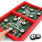 Board game with soccer-themed pieces on a green field layout