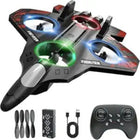 Black and red drone with LED lights, remote control, and accessories on a white background