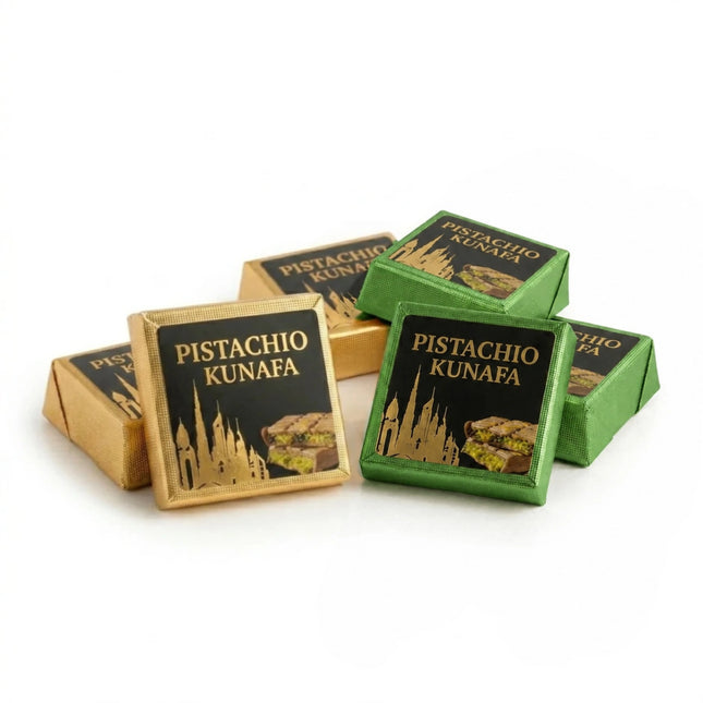 Pistachio Kunafa packaging in gold and green boxes on a white background
