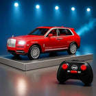 Red toy SUV with remote control on a dark background
