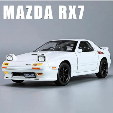 White Mazda RX7 car on a gray background with 'MAZDA RX7' text above.