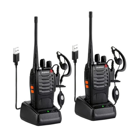 Two black walkie-talkies with earpieces on a white background