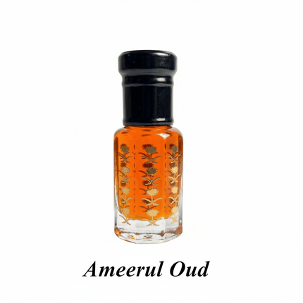 Small glass bottle with orange liquid and black cap on a white background