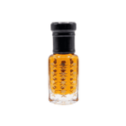 Small glass bottle with black cap containing a yellowish liquid on a white background