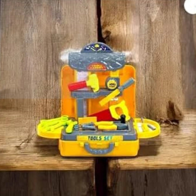 Toy tool set with tools on a wooden surface