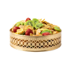 Fruit salad with kiwis, raspberries, and other fruits in a decorative gold basket on a white background