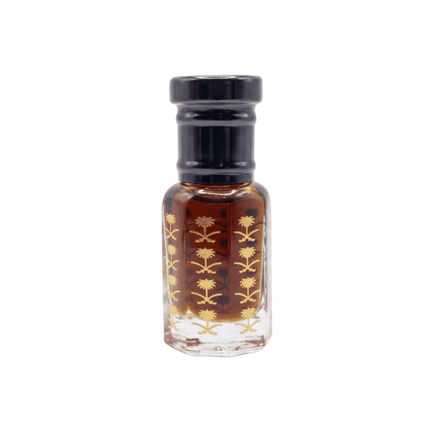 Small glass bottle with black cap and floral design on a white background