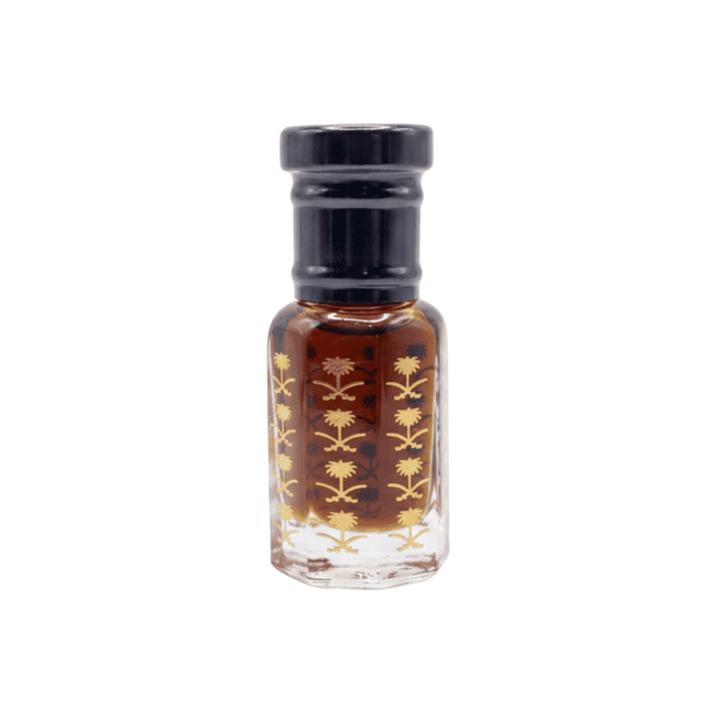 Small glass bottle with black cap and floral design on a white background