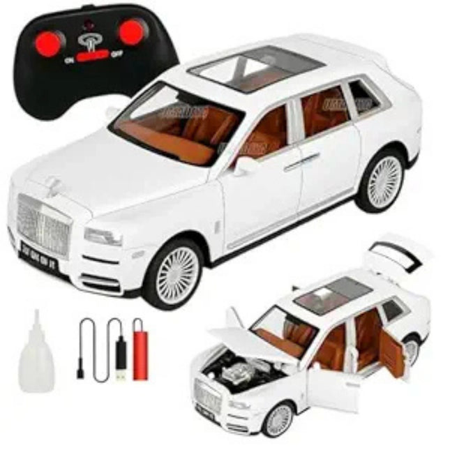 White toy SUV with open door, remote control, and accessories on a white background