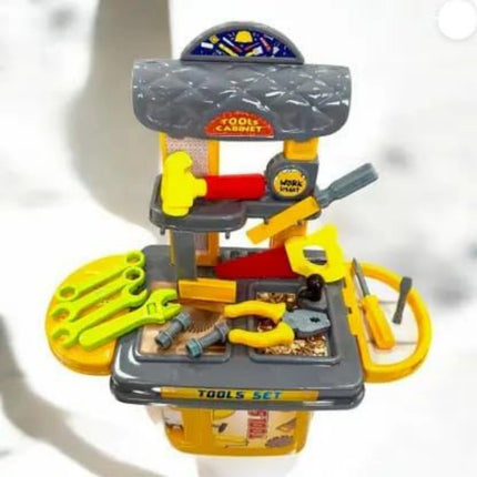 Toy tool set with tools and cabinet on a white background