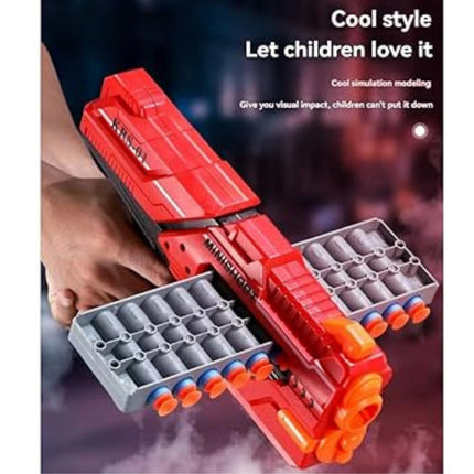 Red toy gun with multiple magazines held by a hand against a dark background