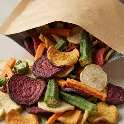 Assorted dried vegetable chips in a brown paper bag