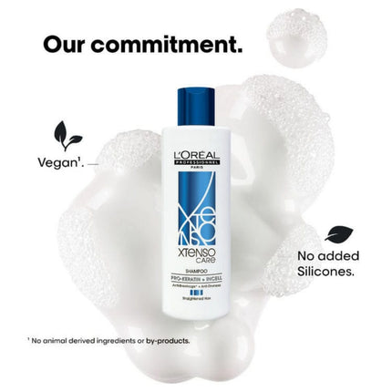 L'Oreal shampoo bottle with foam on a white background, highlighting vegan and silicone-free attributes.