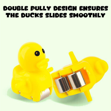 Yellow rubber duck with a double pulley system on a white background