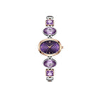 Purple and gold watch with gemstone accents on a white background