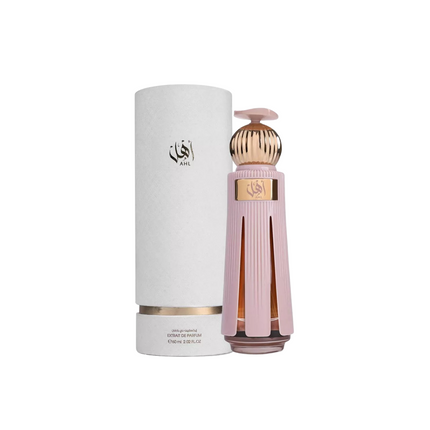 Perfume bottle with gold cap and pink body next to a cylindrical container on a white background