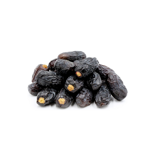 Pile of dark brown dates on a white background
