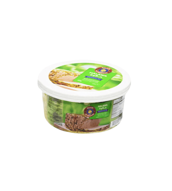 Container of food with green and white label on a white background