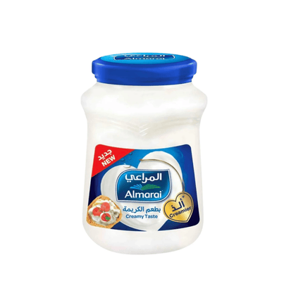 Jar of Almarai creamy taste  cheese on a white background