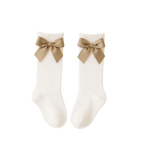 White socks with beige bows on a white background