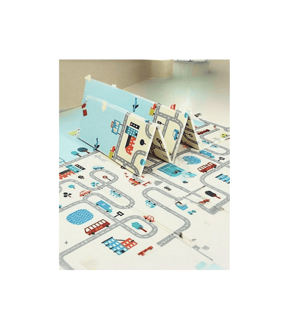 Children's play mat with road design and toy cars on a white background