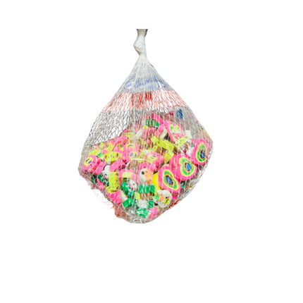 Bag of colorful rubber ducks on a white background