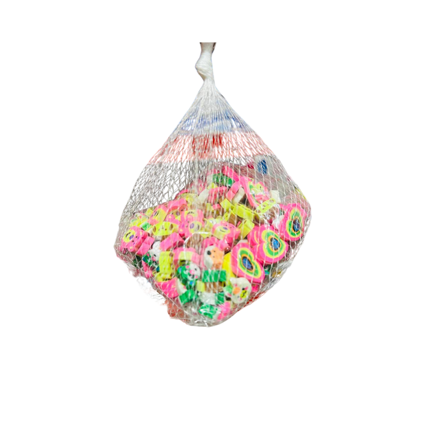 Bag of colorful rubber ducks on a white background