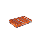 Box of orange Mentos candy on a white background