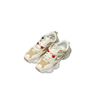 Pair of beige and white sneakers on a white background