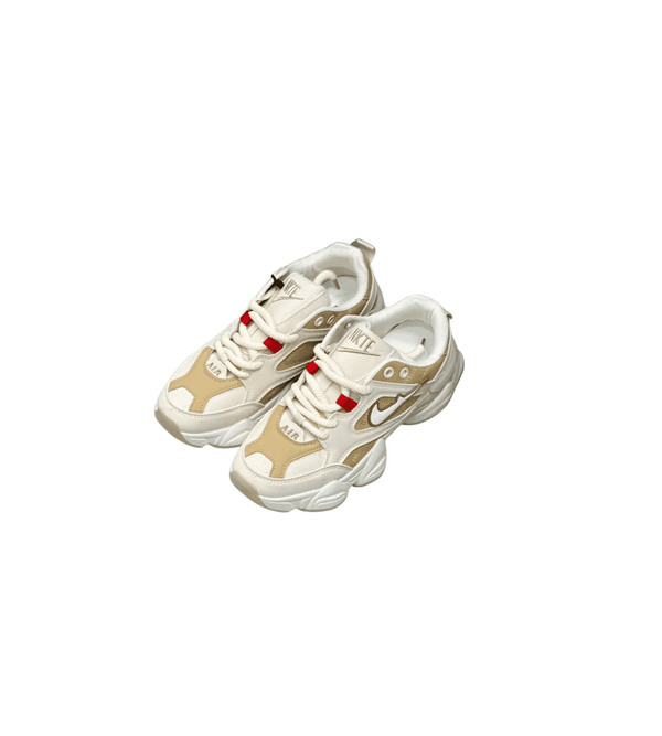 Pair of beige and white sneakers on a white background