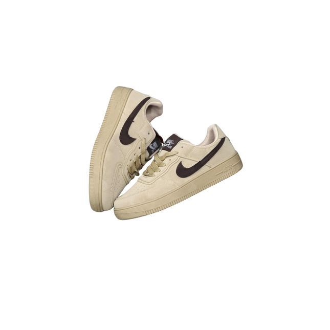 Pair of beige sneakers with black swoosh logo on a white background