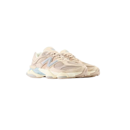 Beige sneakers with light blue accents on a white background