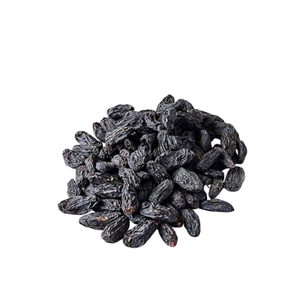 Pile of dark raisins on a white background