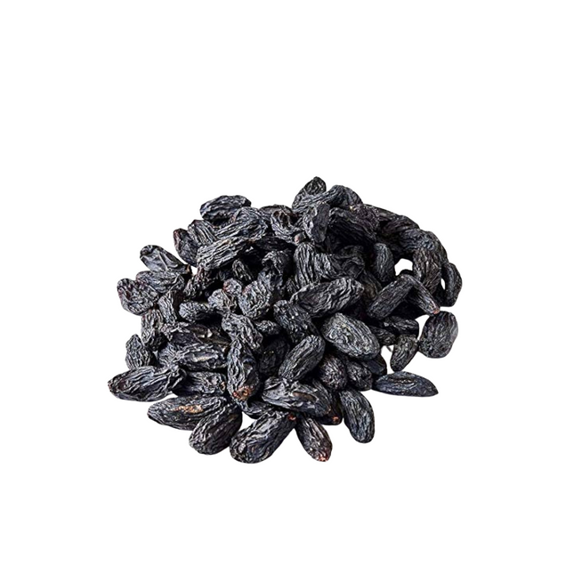 Pile of dark raisins on a white background