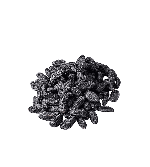 Pile of dark raisins on a white background
