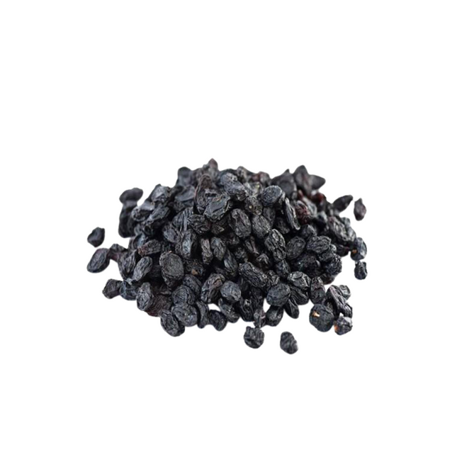 Pile of dark raisins on a white background