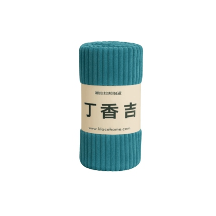 Teal cylindrical soft blanket with a label on a white background