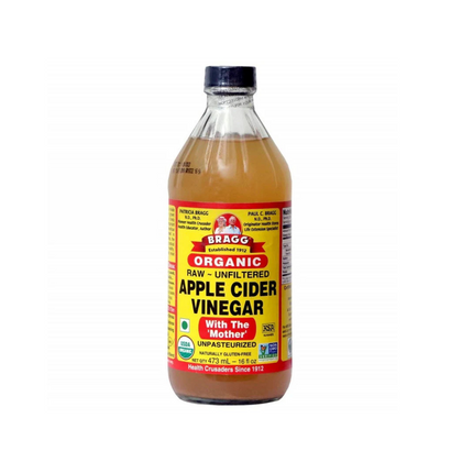 Bottle of Bragg Organic Raw Apple Cider Vinegar on a white background