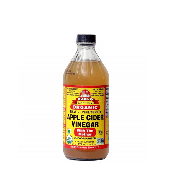 Bottle of Bragg Organic Raw Apple Cider Vinegar on a white background