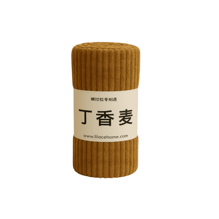 Brown ribbed fabric roll with a label on a white background