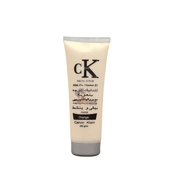 Calvin Klein facial scrub orange tube on a white background