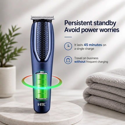 HTC electric trimmer shaver in metallic blue and black, standing on a white marble surface with a green battery graphic and text highlighting battery life, with a plant and folded towels in the background.