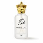 A frosted glass perfume bottle with a metallic gold crown cap, featuring black Arabic calligraphy and the text 'OUD AL ASRA' on the front, set against a plain white background.