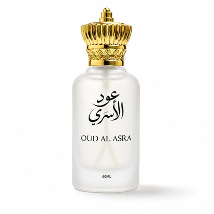 A frosted glass perfume bottle with a metallic gold crown cap, featuring black Arabic calligraphy and the text 'OUD AL ASRA' on the front, set against a plain white background.