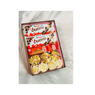 Box of Kinder bueno chocolate bars with flowers on a white background