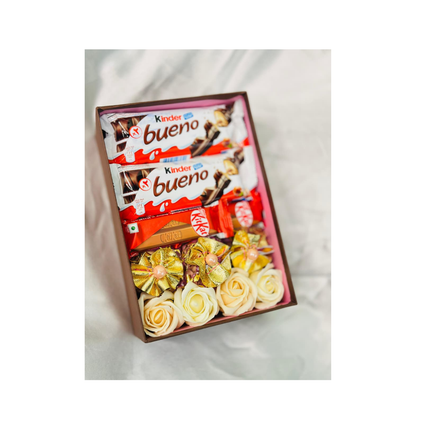 Box of Kinder bueno chocolate bars with flowers on a white background