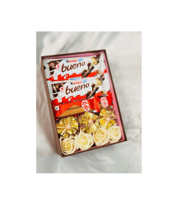 Box of Kinder bueno chocolate bars with flowers on a white background