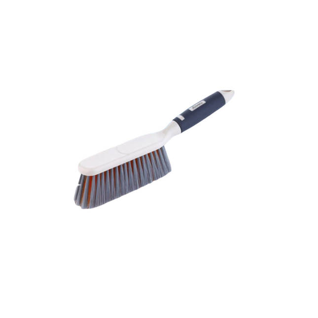 Cleaning brush with white handle and blue bristles on a white background