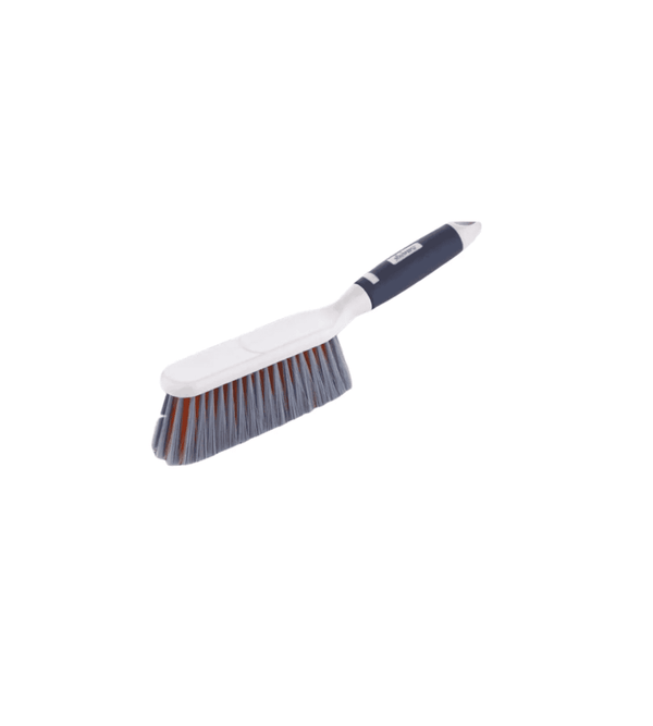 Cleaning brush with white handle and blue bristles on a white background