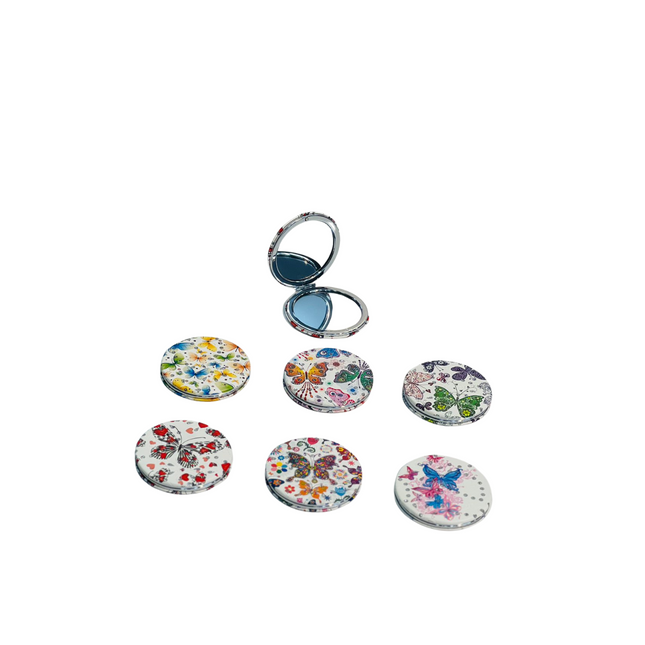 Set of floral and butterfly designs on round keychains with a silver ring on a white background